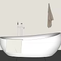 White Freestanding Bathtub With Faucet Towel And Hanging Towel In Modern Bathroom