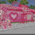 Pink Heart Shaped Outdoor Booth Decorated With Flowers Heart Cup Sign And Green Plants