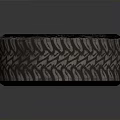 Car Tire With Black Alloy Wheel Rim And Detailed Tread Pattern Design