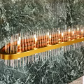 Elegant Modern Chandelier With Gold Frame And Transparent Glass Rods On Marble Wall Background