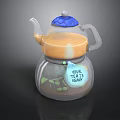 Transparent Teapot With Orange Liquid Blue Textured Lid Label Green Leaf Patterns Your Teas Leafs