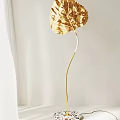 Elegant Gold Leaf Shaped Floor Lamp With Modern Curved Stem Design 3d model