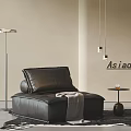 Black Leather Single Seater Sofa With Floor Lamp Side Table Dark Rug And Neutral Wall