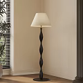 Modern Black Spiral Floor Lamp With Cream Lampshade Near Window Blinds And Green Plant