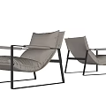 Two Modern Light Gray Leisure Chairs Featuring Black Metal Frames And Soft Cushions