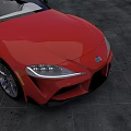 Sleek Red Sports Car Parked On Concrete Ground During Sunset Sky