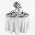 Elegant Dinnerware Set with White Flower Bouquet Candles Gray Tablecloth Plates Cutlery Wine Glasses