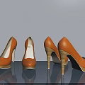 Three Pairs Of Orange High Heels With Wooden Heels On Gray Background