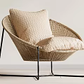 Modern Curved Rattan Leisure Chair With Beige Cushion And Black Metal Legs
