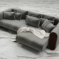 Gray Sectional Sofa with Multiple Pillows Dark Wooden Armrests and Light Blanket on Marble Floor