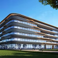 Modern Office Building With Curved Glass Facade And Green Lawn Surroundings Under Blue Sky