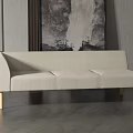 Light Beige Three Seater Sofa with Wooden Legs Against Grey Wall and Artwork