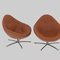 Pair of Brown Leather Accent Chairs with Curved Design and Black Metal Swivel Base