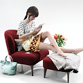 A Woman Using Tablet While Sitting On Red Armchair With Blue Handbag And Flowers