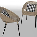 Two Woven Rattan Leisure Chairs with Black Legs and Black White Checkered Cushions