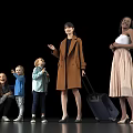 Group of Multiethnic People Including Adults and Children with Travel Luggage Standing Against Black Background