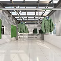 Green Uniforms Display Interior With Bright Lighting And Metal Hanging Racks