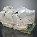 Broken Stone Sculpture With Wooden Base And Natural Grass Surroundings