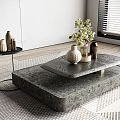 Modern Stone Coffee Table With Vases Green Plants On Patterned Rug In Living Room Interior