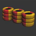 Stacked Yellow and Red Tires with Black Centers on Dark Reflective Background