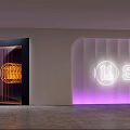 Modern Shopping Mall Store Entrance With Neon Sign Purple Lighting And Orange Decorative Design
