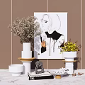Elegant Decorative Ornament Set With Portrait Painting Vase Green Plants And Books On Marble Tabletop