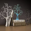 Tree Shaped Decorative Ornament Set with Silver Blue Dark and Stacked Books on Wooden Table