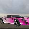 Pink Sports Car Parked By Seaside With Ocean View And Cloudy Sky