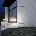 Entrance Gate With Stone Lantern Shaped Lamps White Walls Green Plants Under Blue Night Sky