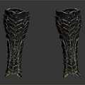 Pair of Medieval Black Leg Armor With Wavy Textured Patterns And Metallic Finish