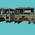 Old Rusted Car Fronts In Light Gray And Green With Damaged Parts