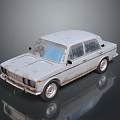 Vintage Silver Sedan with Rusty Exterior on Reflective Gray Background