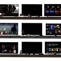 Modern Smart TV Screens Displaying Streaming Apps On Wooden TV Stand With Decor
