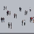 Diverse Group of People Standing in Small Groups in Open Space