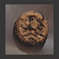 Golden Brown Chocolate Chip Cookie With Chunks Placed On A Paper 3d model