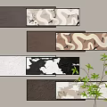 Textured Abstract Paintings With Brown White Black Tones Wall Mounted Artworks And Green Plant