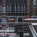 Modern Industrial Plant Exterior With Metal Pipes Steel Frames And Equipment