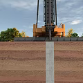 Industrial Pile Driving Equipment Operating In Foundation Construction With Soil Layers And Concrete Pile