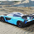 McLaren Blue Racing Car On Sandy Beach With Aerodynamic Rear Wing