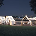 Scenic Garden Landscape Featuring Illuminated Tents Lawn Seating And Night Lighting