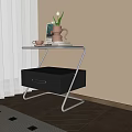 Modern Bedroom Nightstand with Metal Frame and Black Drawer holding Vase Cup and Book