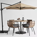 Round Outdoor Table With Woven Chairs Beige Umbrella And Decorative Lantern Pinecones