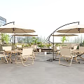 Outdoor Chairs in Patio Setting With Sun Umbrellas Green Plants and Gray Floor Tiles