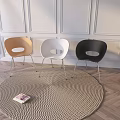 Modern Table And Chair Set With Round Woven Rug Potted Plant And Decorative Painting