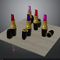 Colorful Lipsticks With Black Cases And Gold Bases Open Closed On Wooden Tray