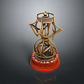 Golden Ornate Sculpture With Intricate Metal Design And Red Base Stand