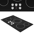 Modern Induction Cooktop With Black Surface Control Knobs And Heating Zones