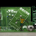 FIFA World Cup 2022 Football Themed Display With Green Decor And Yellow Jersey Figures