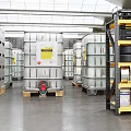 Industrial Warehouse Storage Space With Yellow Metal Shelving Toolboxes Tires And Containers