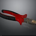 Professional Pliers With Red And Black Handles And Metal Cutting Jaws